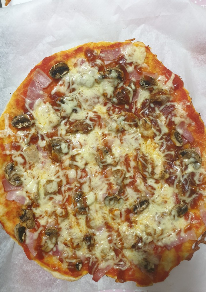 Una foto de Pizza casera con especias BBQ