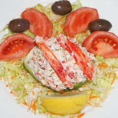 A picture of Stuffed avocado with king crab salad.
