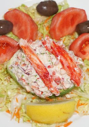 A picture of Stuffed avocado with king crab salad.