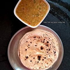 A picture of Pulka Roti and green moong dal.