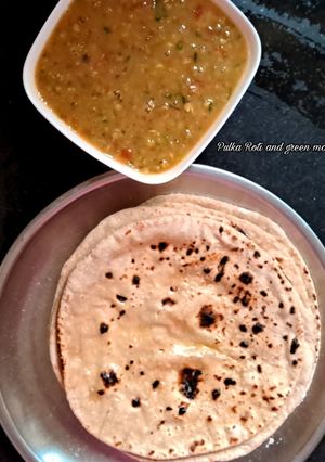 A picture of Pulka Roti and green moong dal.