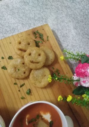 A picture of Potatoes smiley with tomato soup.