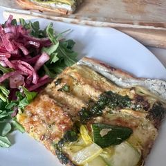 A picture of Zucchini (Courgette) Tart with Lemon Ricotta and Basil Olive Oil.