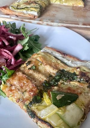 A picture of Zucchini (Courgette) Tart with Lemon Ricotta and Basil Olive Oil.