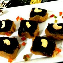 A picture of Besan coconut barfi with chocolate topping.