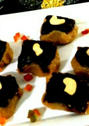 A picture of Besan coconut barfi with chocolate topping.