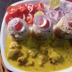 A picture of Besan kadhi pakoda with Rice.