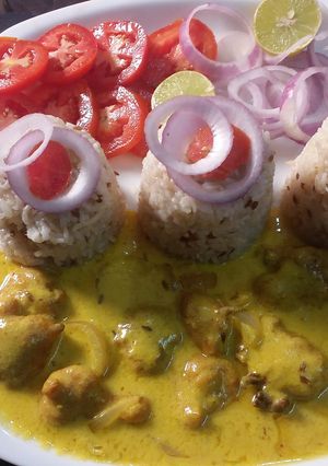 A picture of Besan kadhi pakoda with Rice.