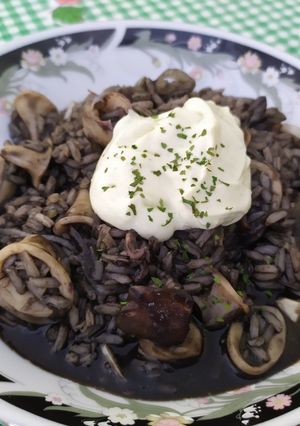 A picture of Arroz Negro with Baby Squid and Aioli.