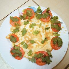 Fried eggs with fresh vegetables A picture of Fried eggs with fresh vegetables.