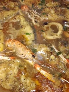 Una foto de Suquet de corvina con cigalas y calamares