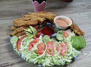 Una foto de fajitas de pescado