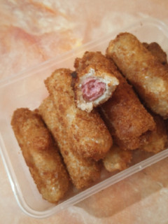 A picture of Bread and sausage rolls.