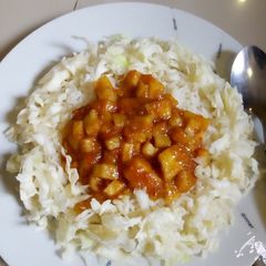 A picture of Rice with yam sauce.