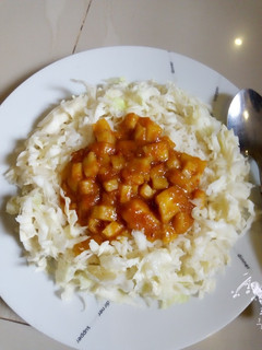 A picture of Rice with yam sauce.
