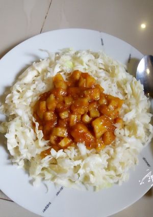 A picture of Rice with yam sauce.