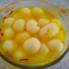 Kamala bhog orange flavour rasgolla A picture of Kamala bhog orange flavour rasgolla.