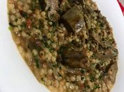Una foto di fregola con verdure