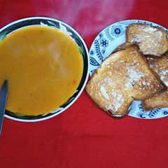 A picture of Vegetable Soup and Toasted Bread.