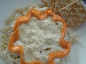 Una foto de fideos con salsa blanca con crema