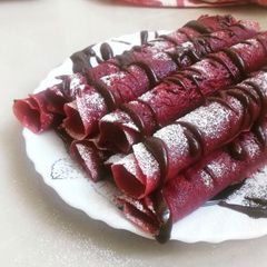 A picture of Red Velvet Crepes With Chocolate Drizzle.