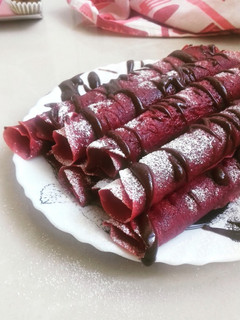 A picture of Red Velvet Crepes With Chocolate Drizzle.