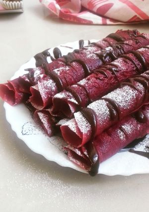A picture of Red Velvet Crepes With Chocolate Drizzle.