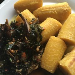 A picture of Half Ripe Plantain Meshed With Smoked Fish vegetable sauce.
