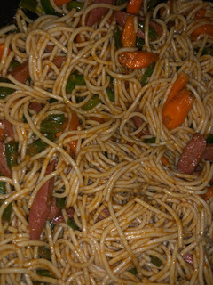 A picture of Spaghetti and sausage.