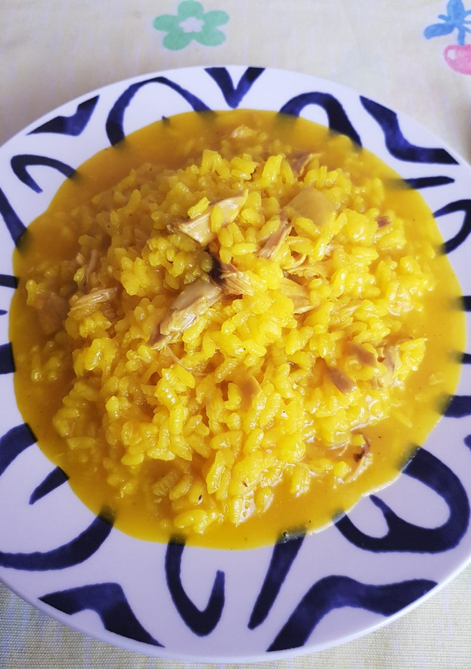 Una foto de Arroz caldosito con pollo