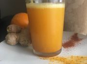 A picture of turmeric and ginger shots