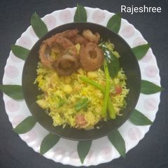 A picture of Potato Fried Rice With Onion Rings.