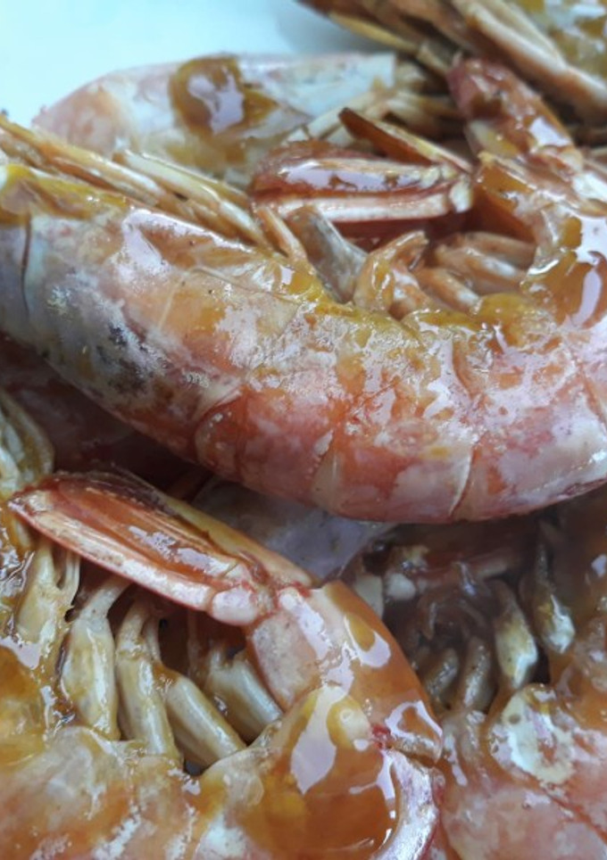 Una foto de Langostinos a la plancha con naranja