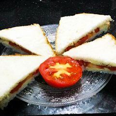 A picture of Tomato cheese sandwich.