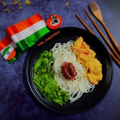 A picture of Shrimp Rice Noodles with stir fried vegetables.