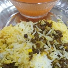 A picture of Black masoor pulao with tomato soup.