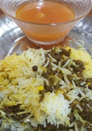 A picture of Black masoor pulao with tomato soup.
