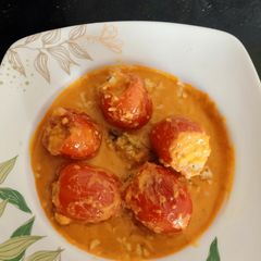 A picture of Stuffed Tomatoes in Makhni Gravy.