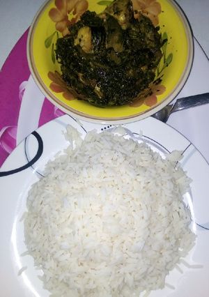 A picture of White rice with vegetables soup.