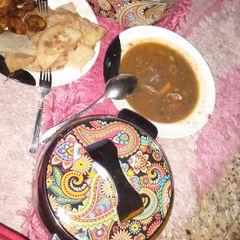 A picture of Fried yam and egg, plantain and meat pepper soup.