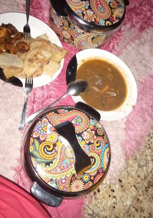 A picture of Fried yam and egg, plantain and meat pepper soup.