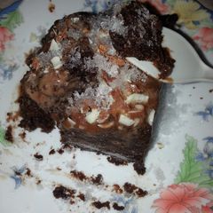 A picture of Moist Chocolate Nut Cake In Crushed Sugar Granules.