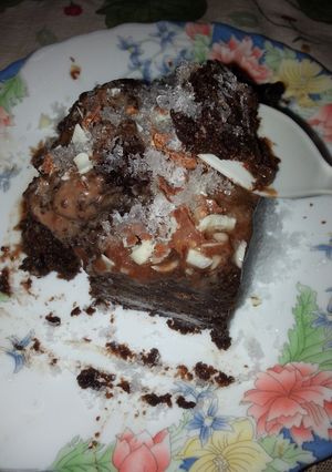 A picture of Moist Chocolate Nut Cake In Crushed Sugar Granules.