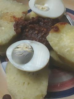 A picture of Sweet potatoes with boiled egg and sauce.