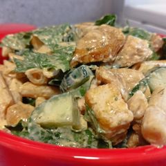A picture of Chicken pasta caesar salad.