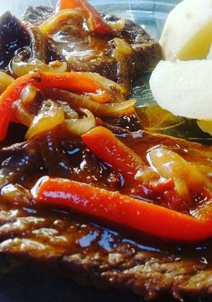 Una foto de Bifes a la criolla