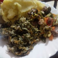 A picture of Mashed Bananas with brocoli meat stew and steamed cabbages.