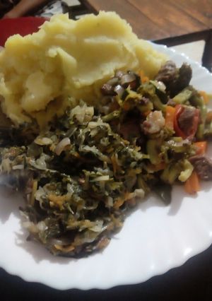 A picture of Mashed Bananas with brocoli meat stew and steamed cabbages.
