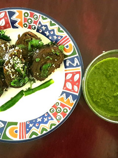 A picture of Patra with Green Chutney.