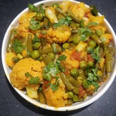 A picture of Cauliflower French Beans and Green Peas Curry.
